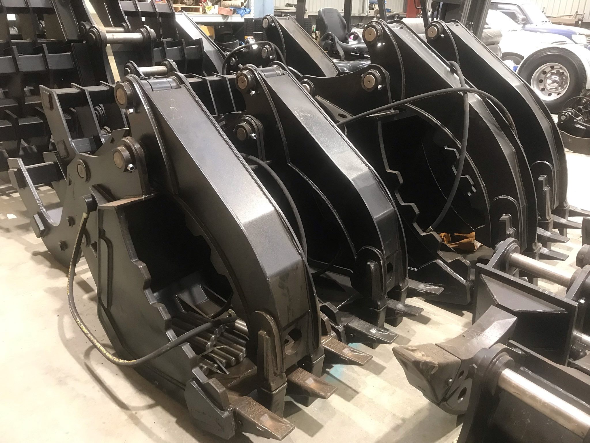 Multiple excavators lined up on a job site